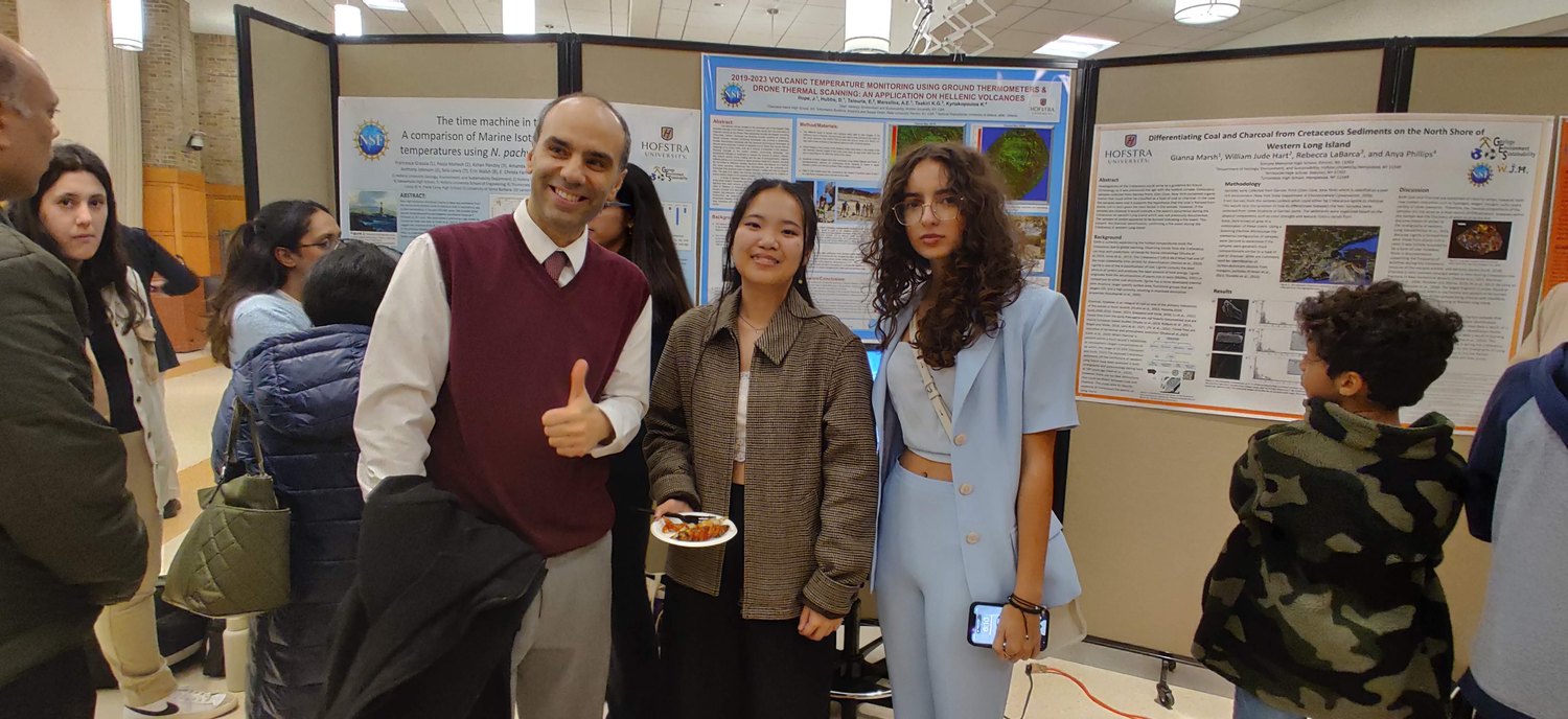 Dr. Marsellos with university students at a Hofstra research poster day